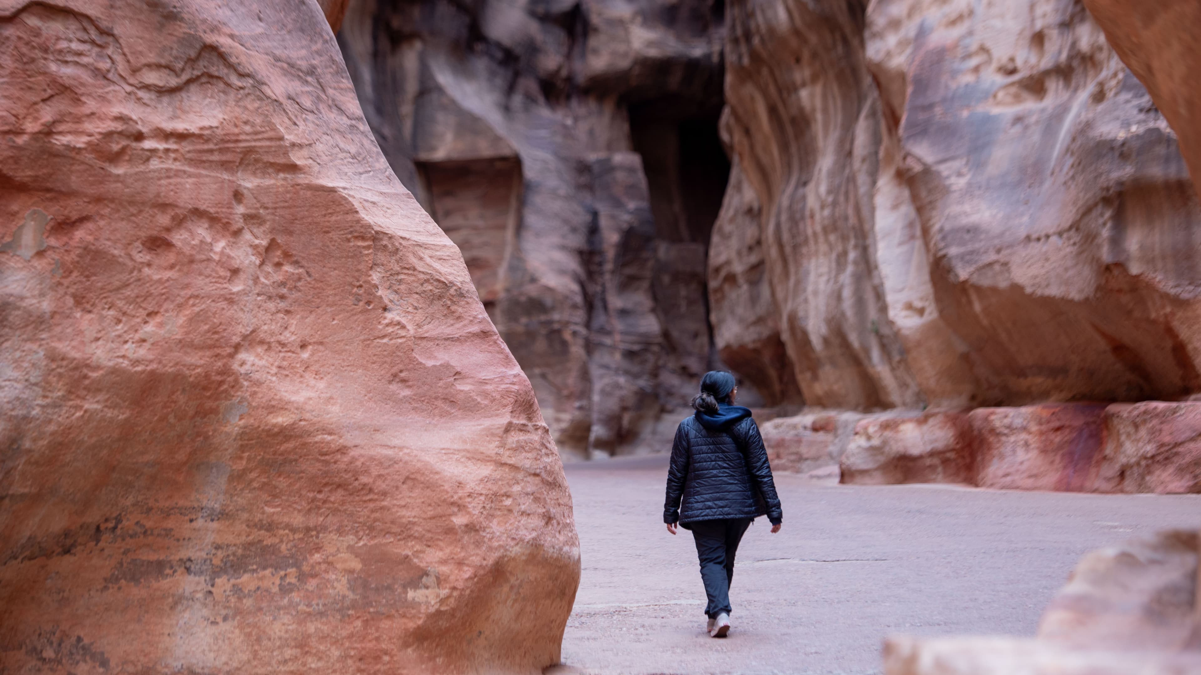 Biji walking through a canyon in Petra, Jordan